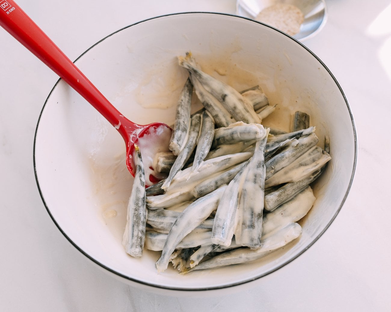 tossing smelts in batter