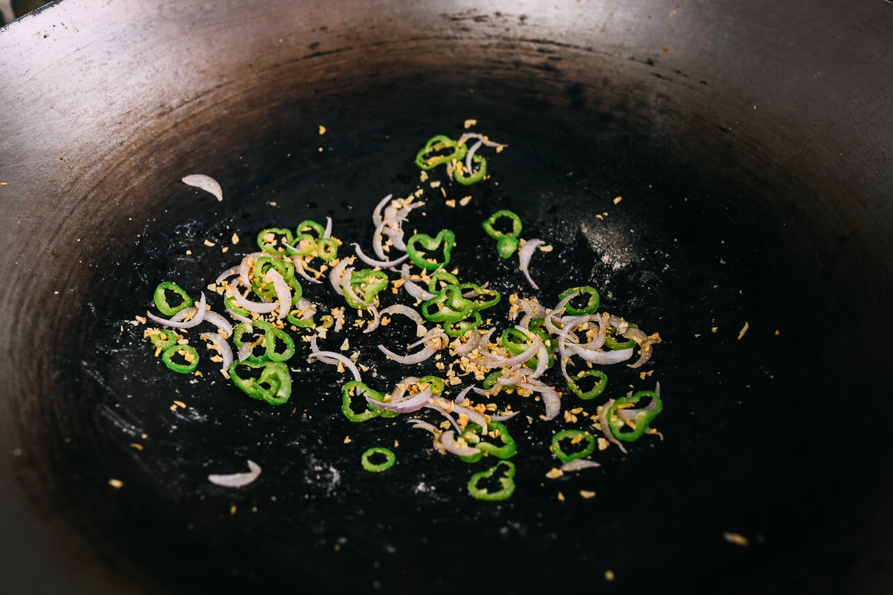 seasoned peppers, shallots and fried garlic in wok