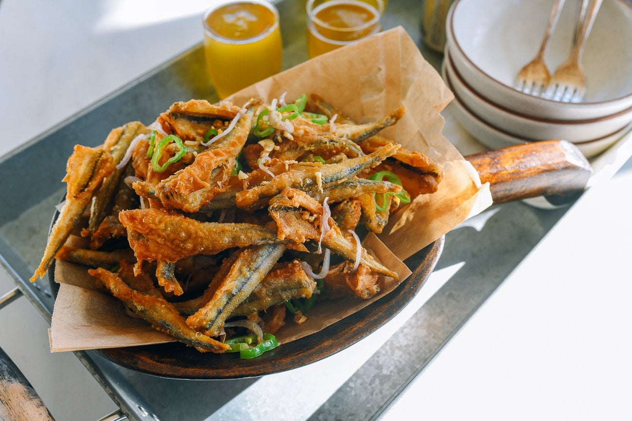 salt and pepper fried smelts served with beer