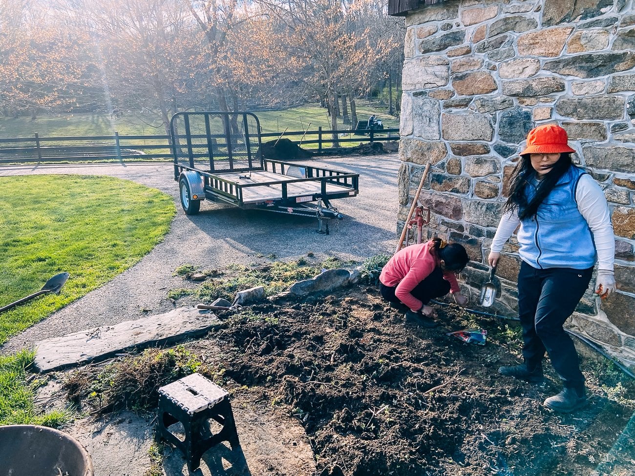 Kaitlin and Judy weeding a garden bed