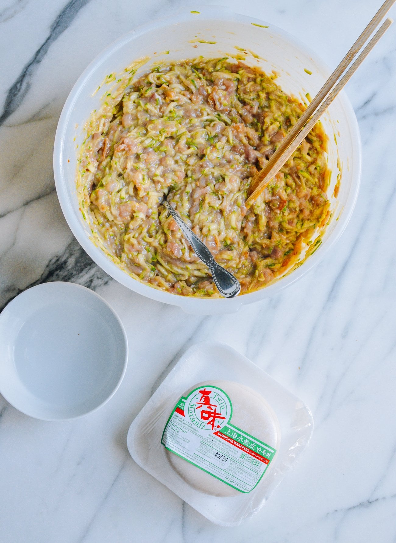 bowl of dumpling filling and wrappers