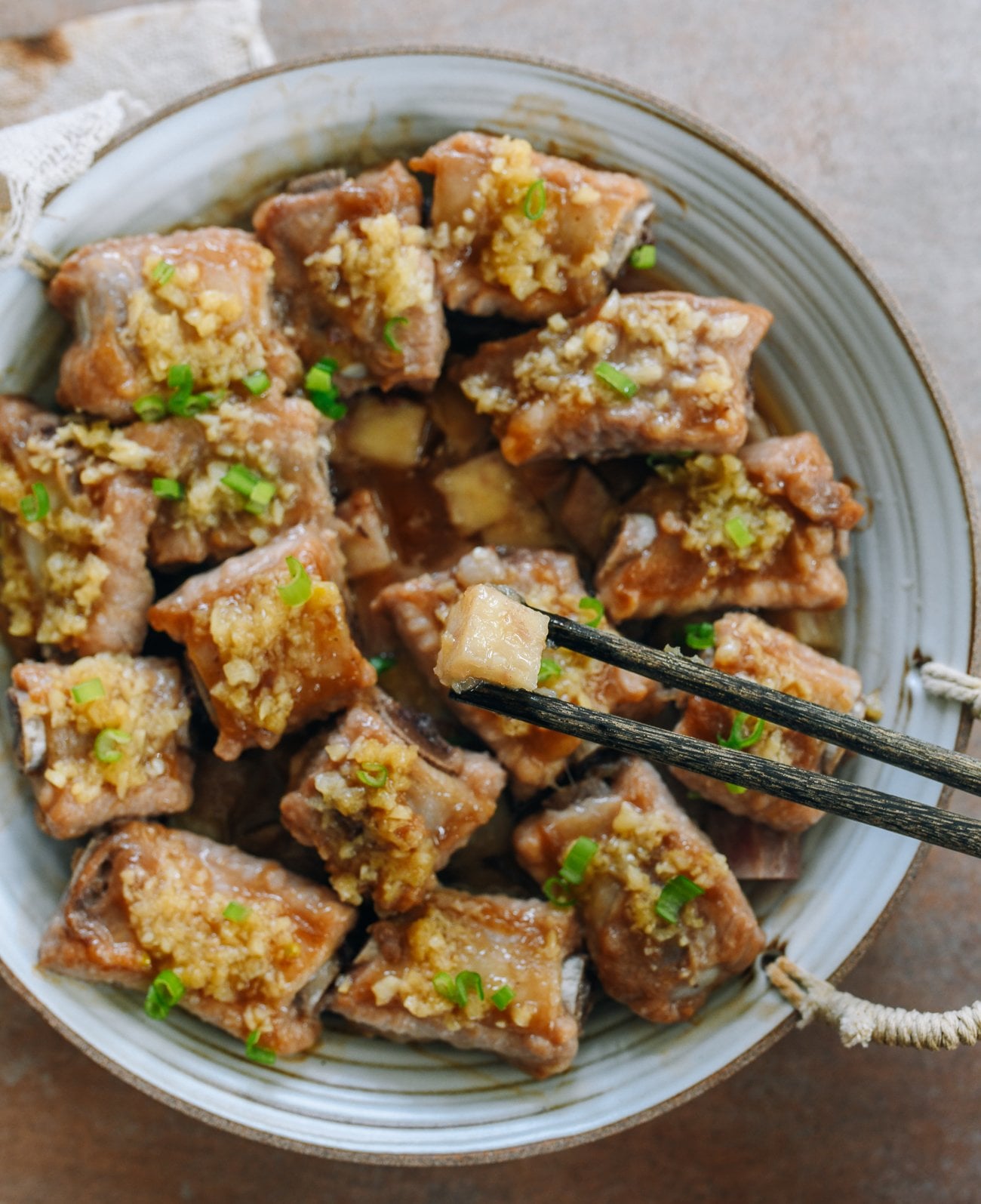 picking up a piece of taro