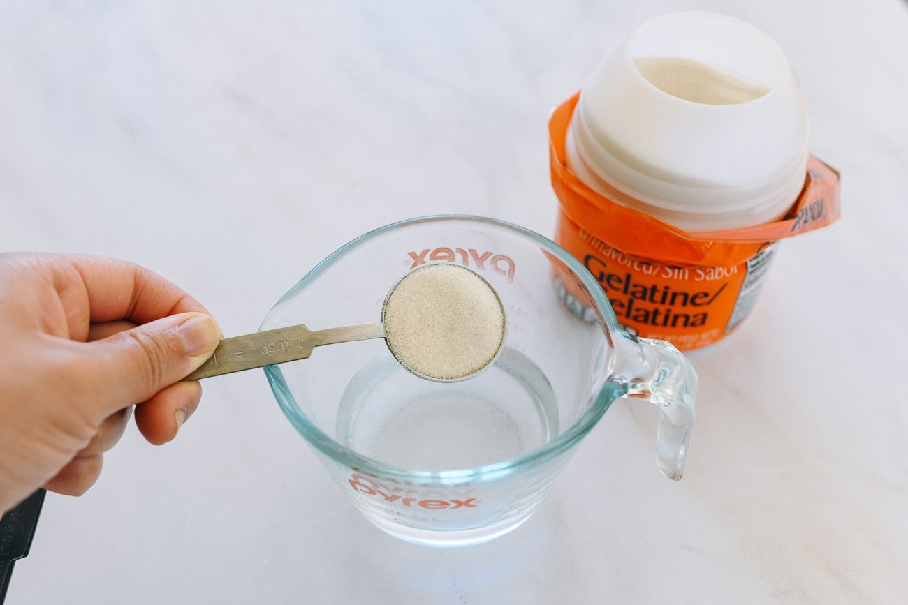 a tablespoon of gelatin powder over a measuring cup of water