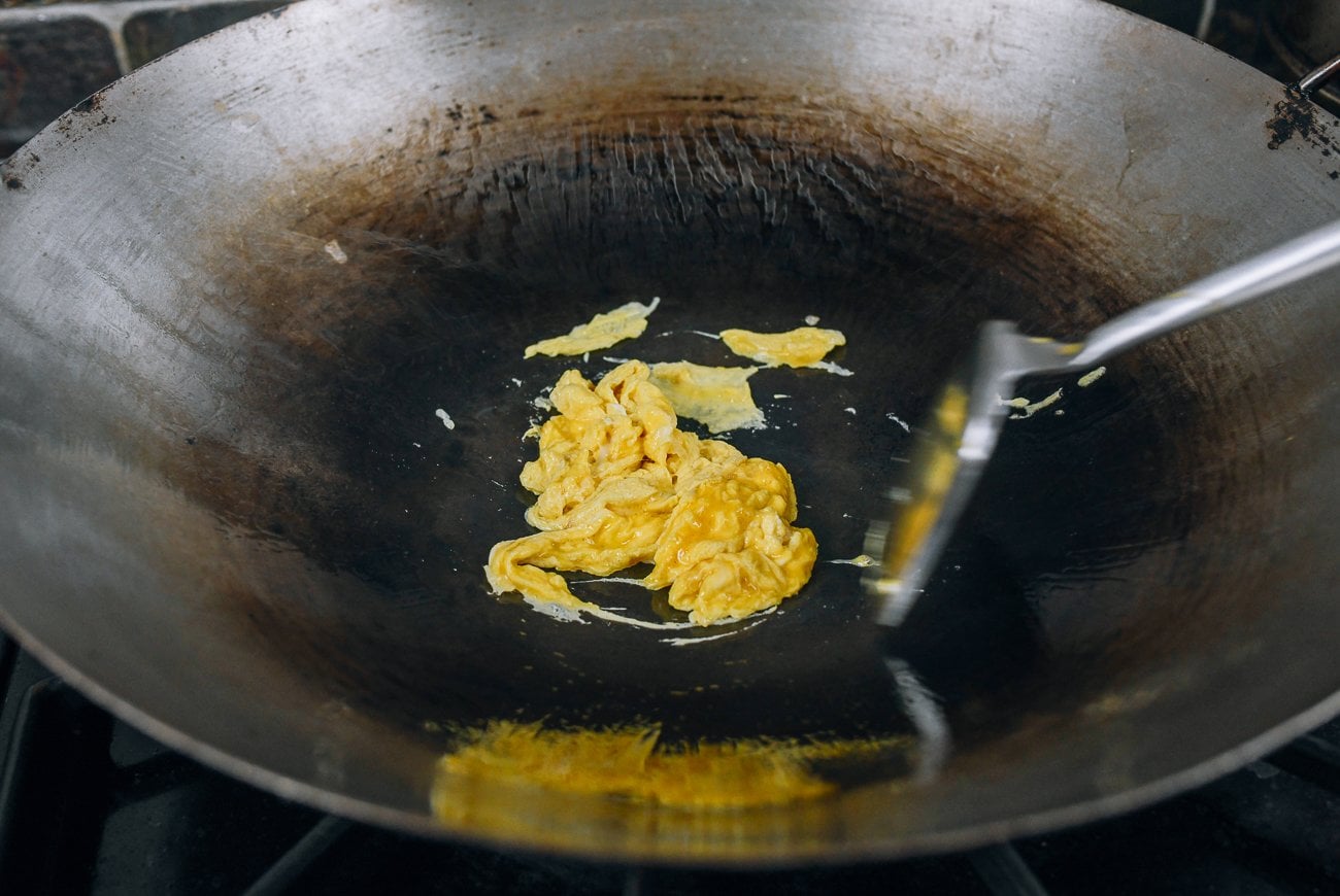 scrambling eggs in wok