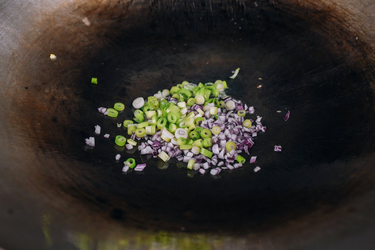 onions and scallions in wok
