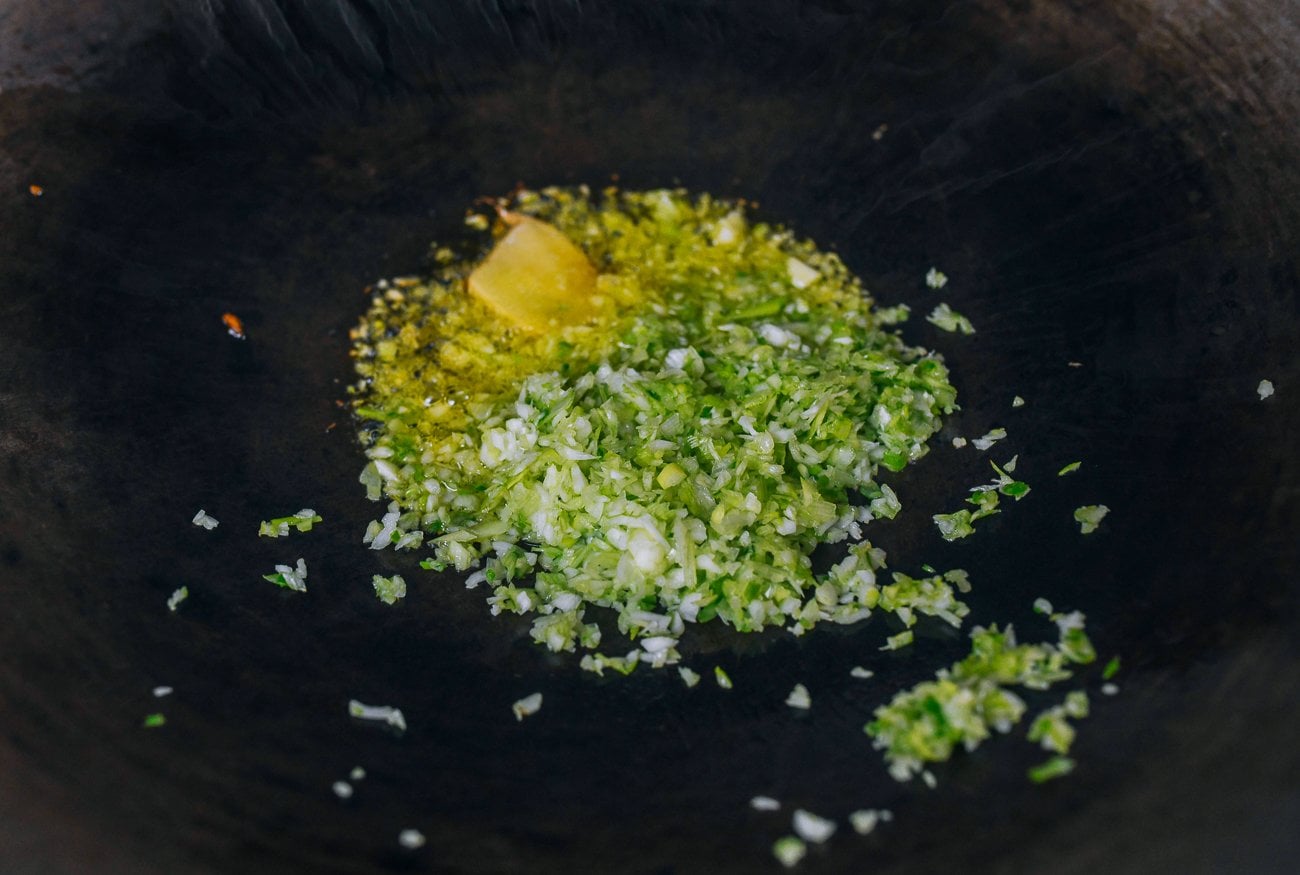 chopped scallion whites with ginger in oil
