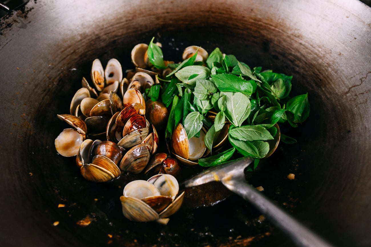 Adding Thai basil to clams