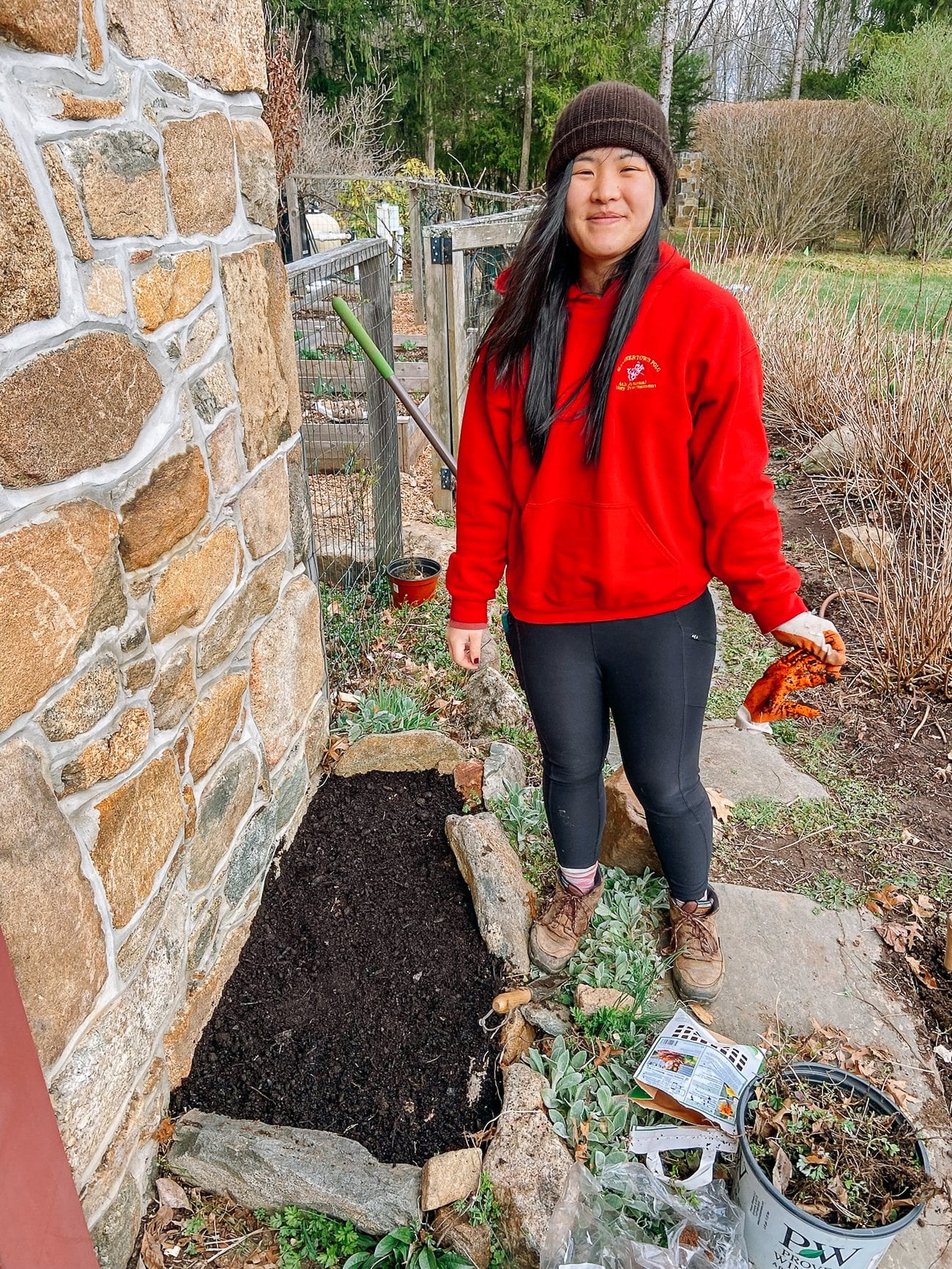 sarah in front of weeded bed