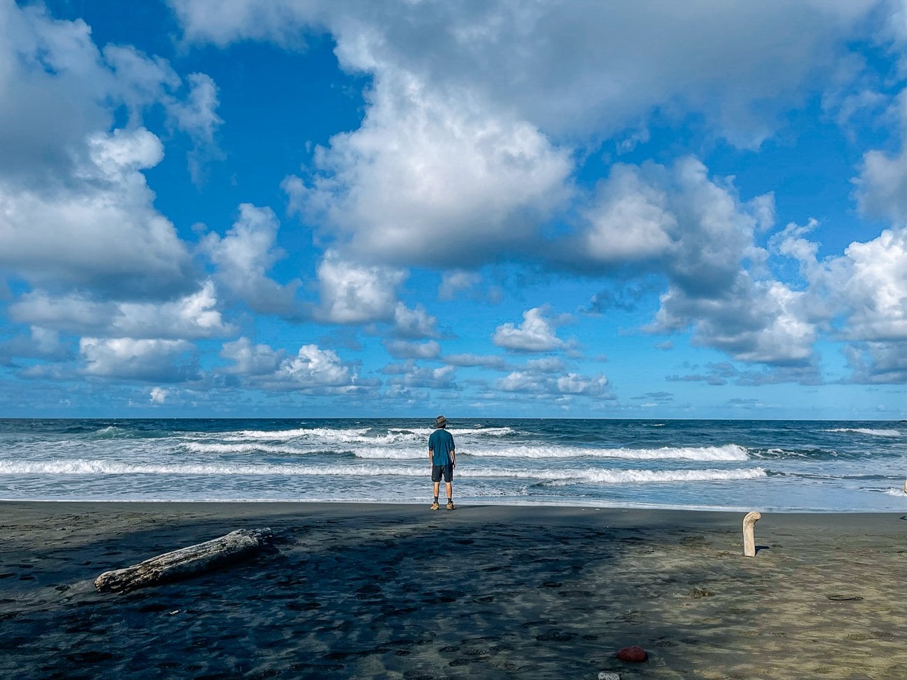 Justin on black sand beach in Pololu Valley