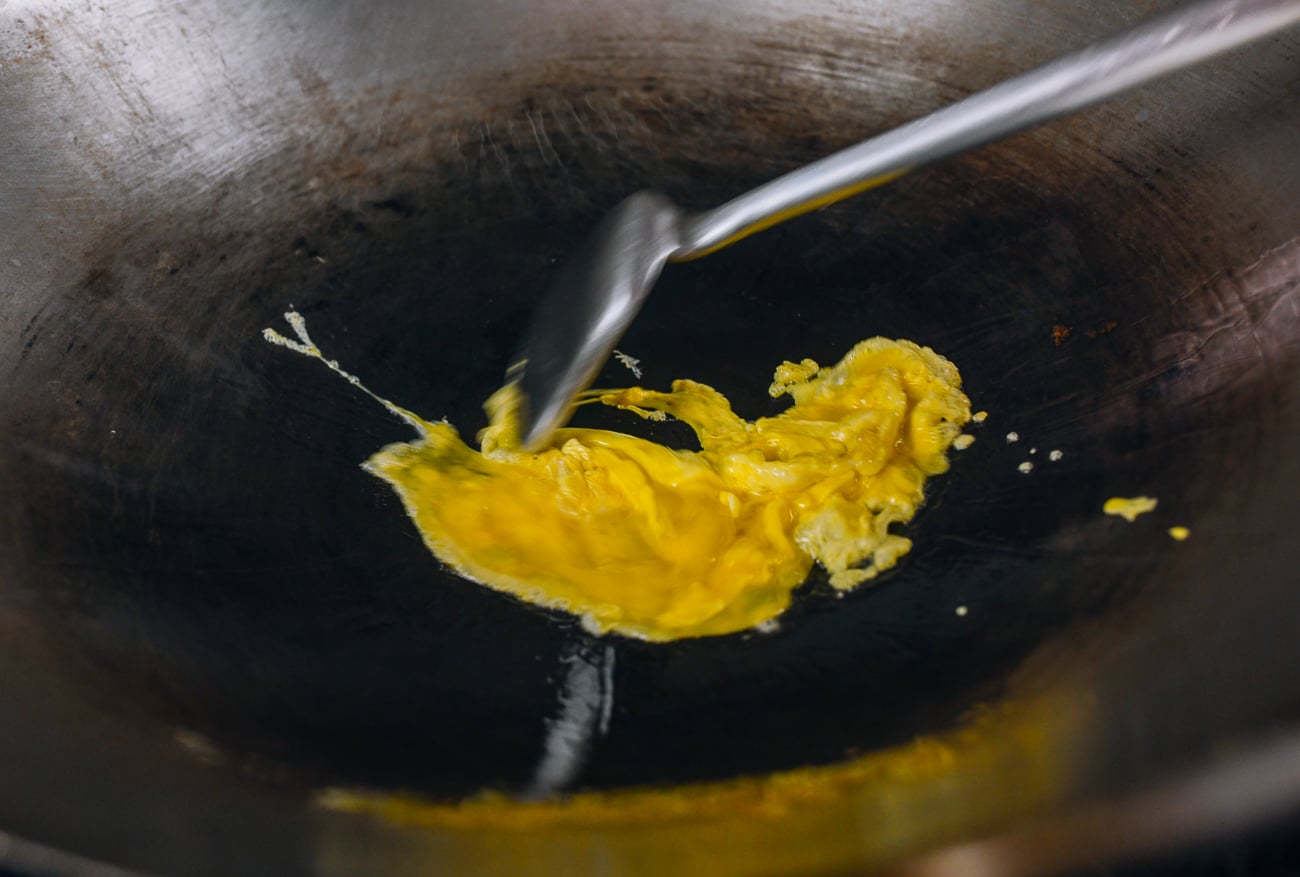 scrambling eggs in wok
