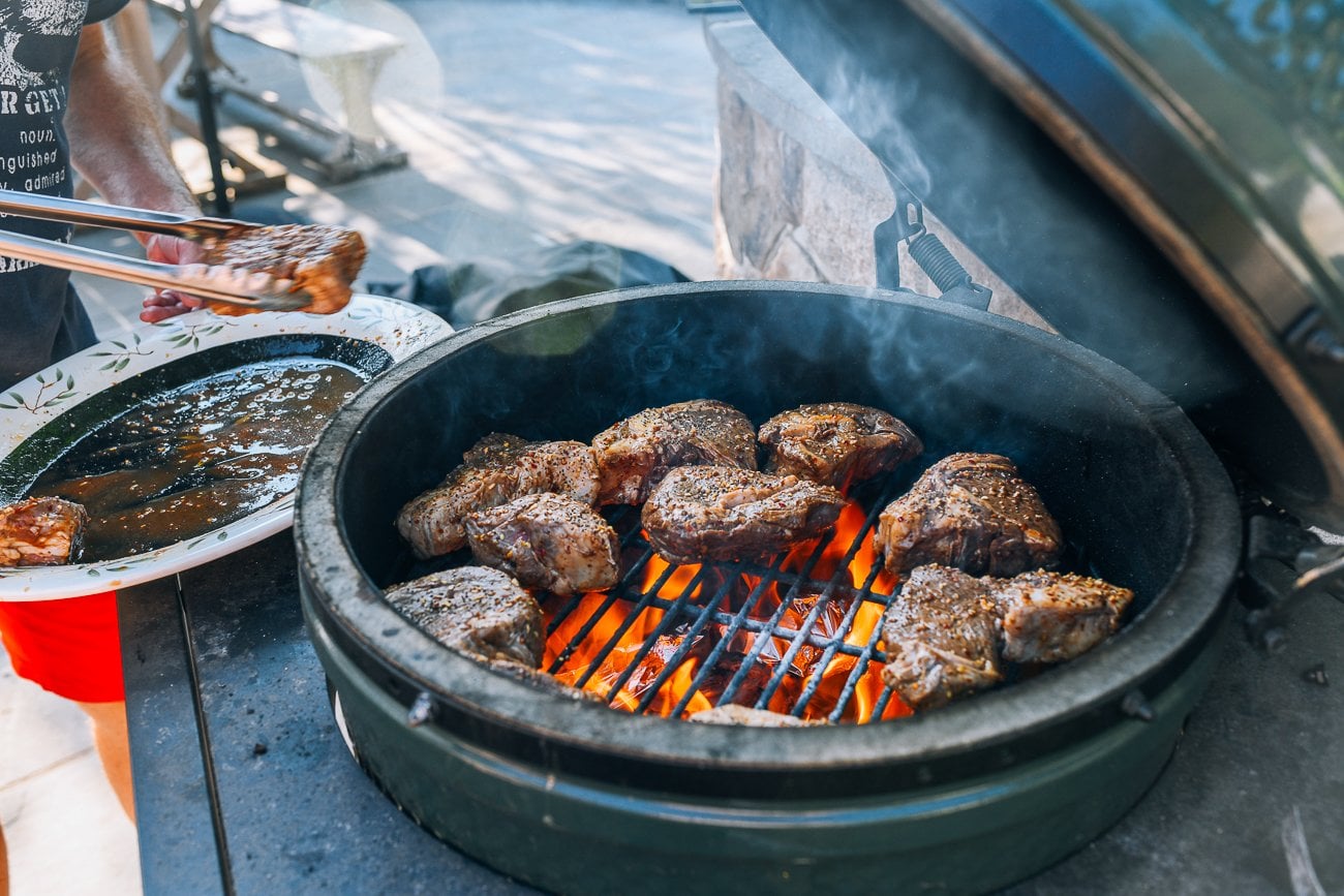 putting steaks on big green egg