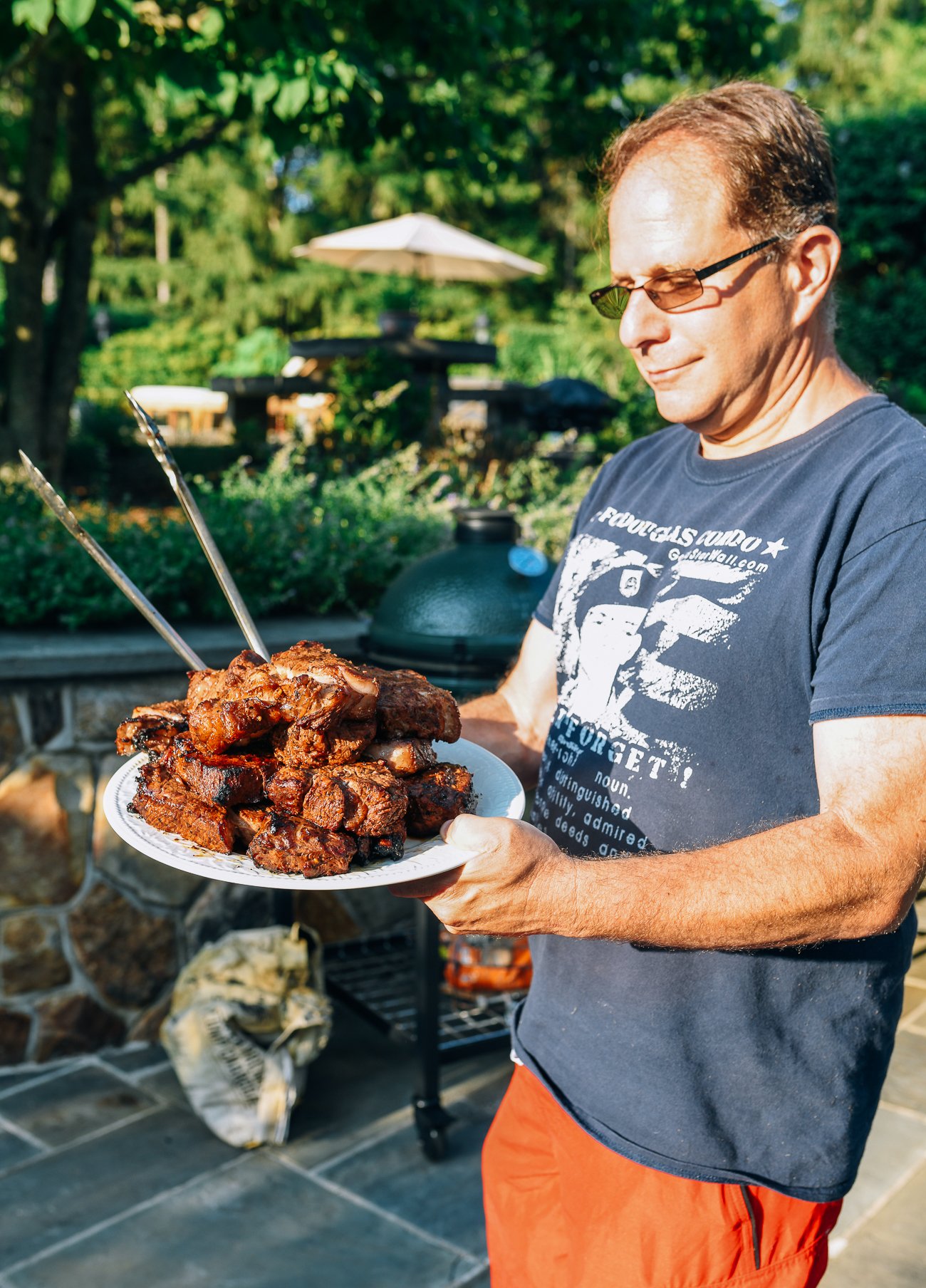 Chris Carson holding plate of steaks