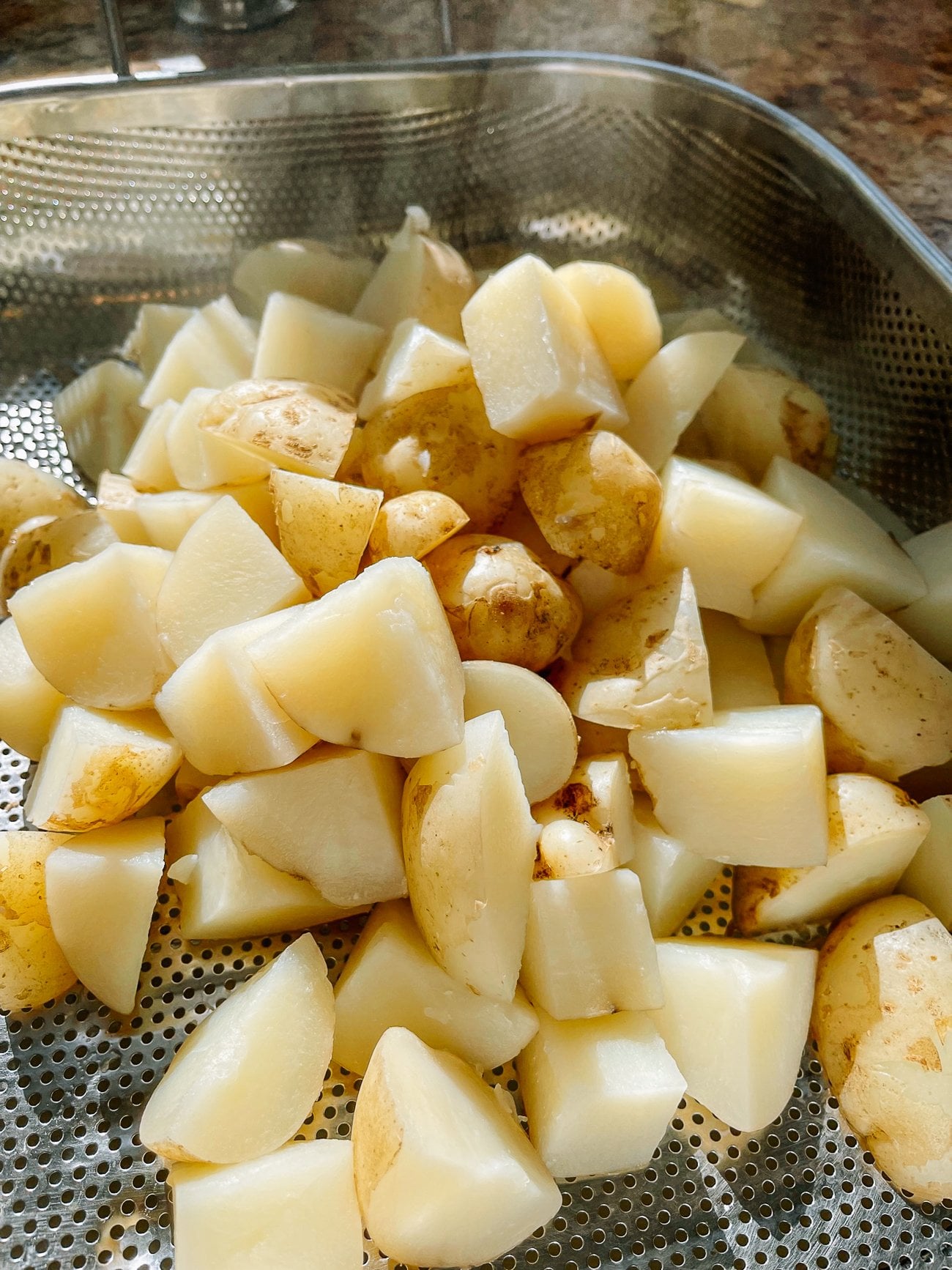 boiled potatoes in colander