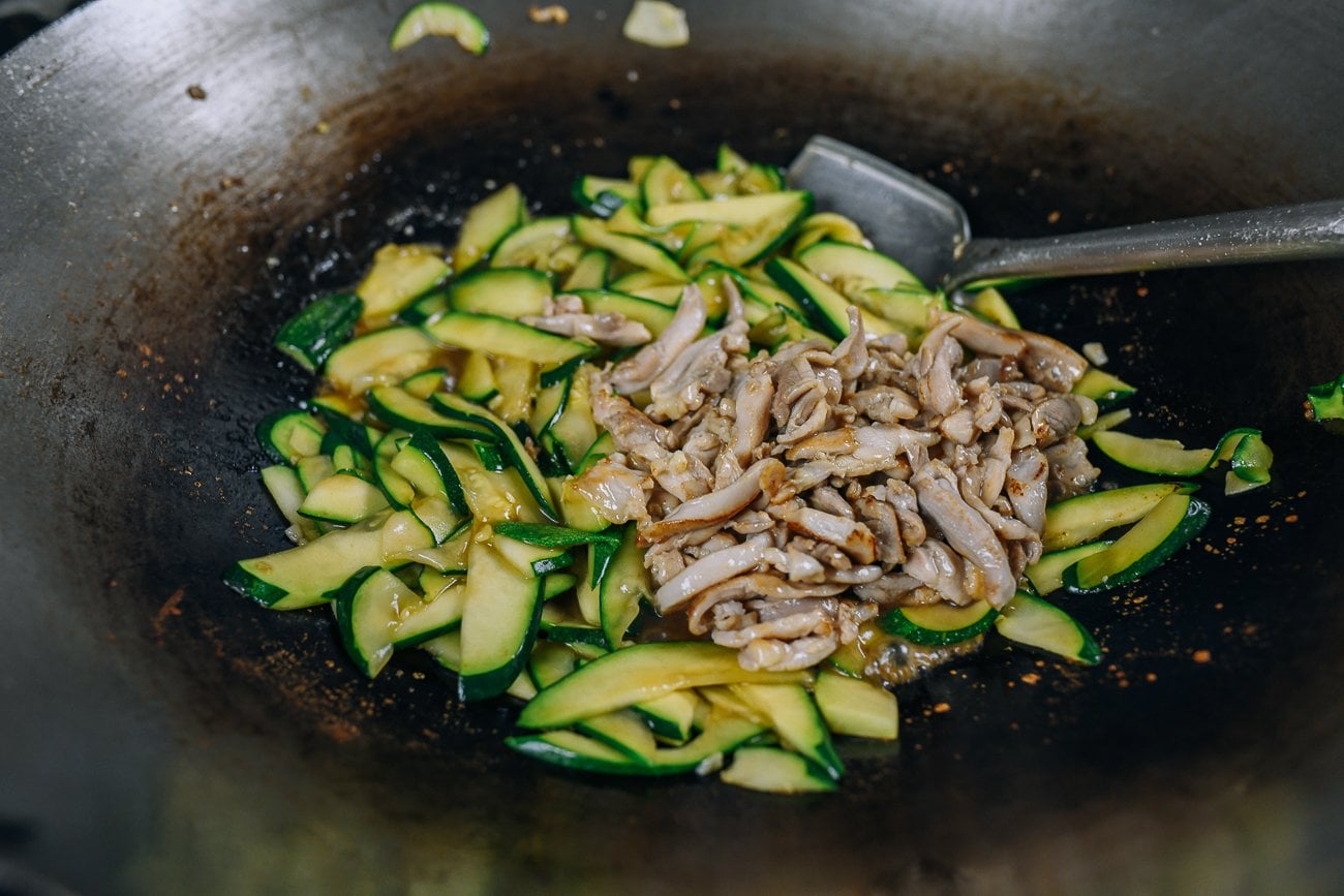 chicken added to zucchini in wok