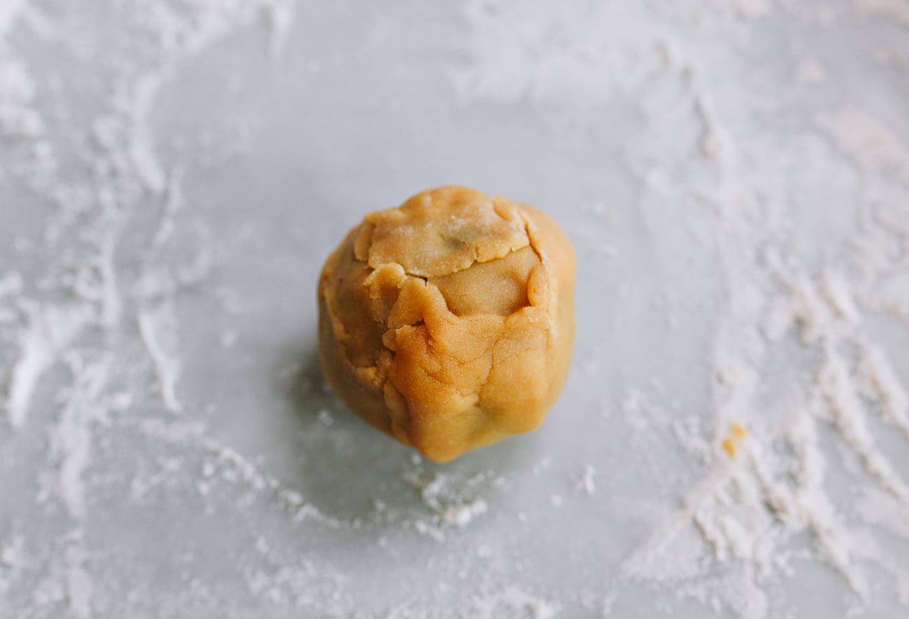 mooncake dough around ball of filling