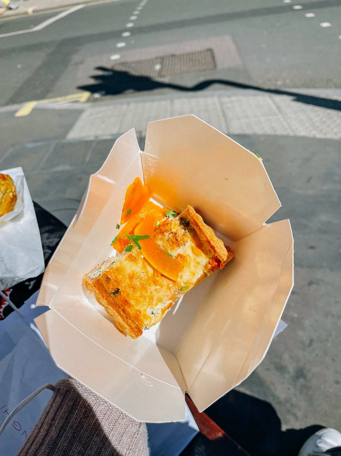 Butternut squash tart in takeout container