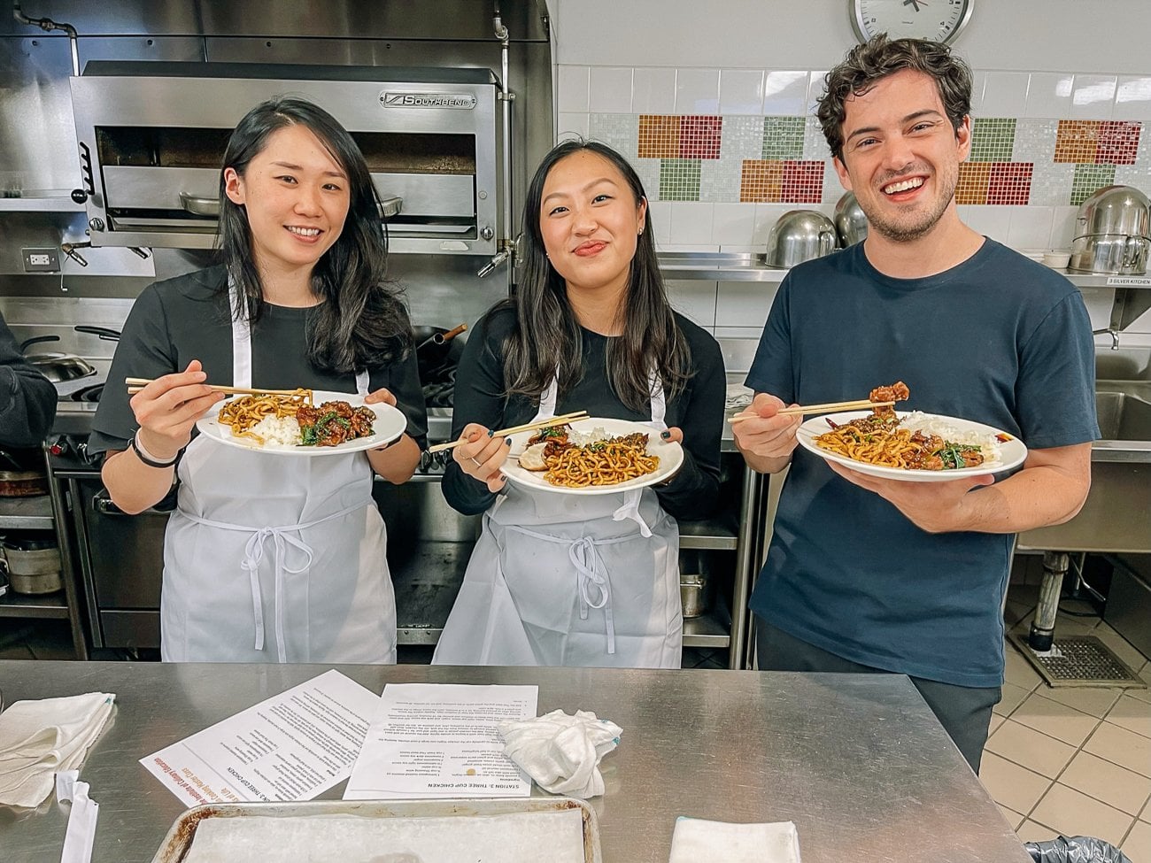 students enjoying meal after cooking class