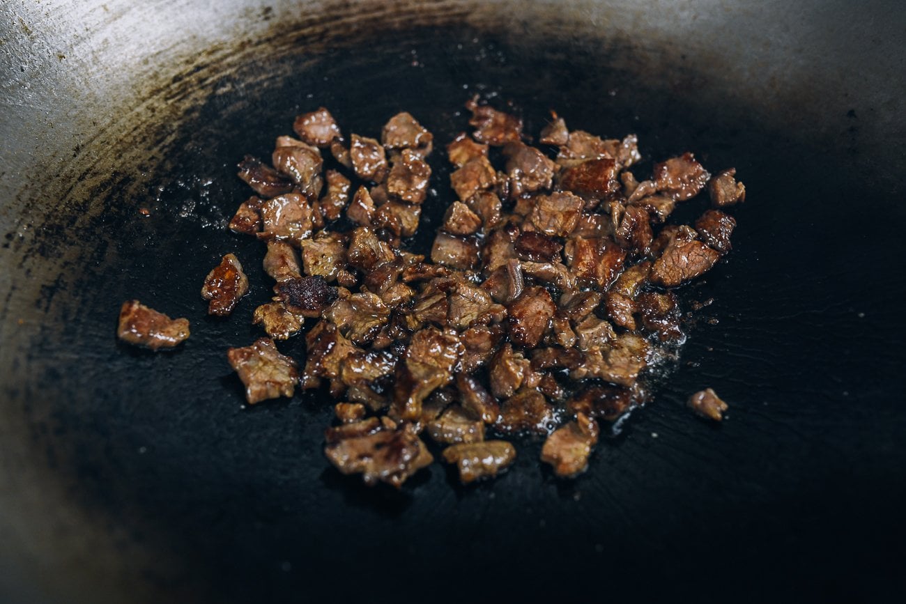 seared beef in wok