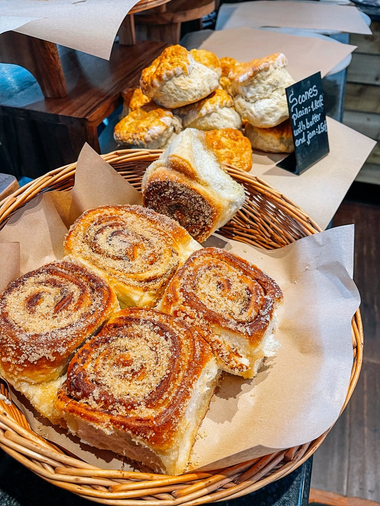 Scones and a basket of cinnamon sugar rolls with lots of coarse sugar
