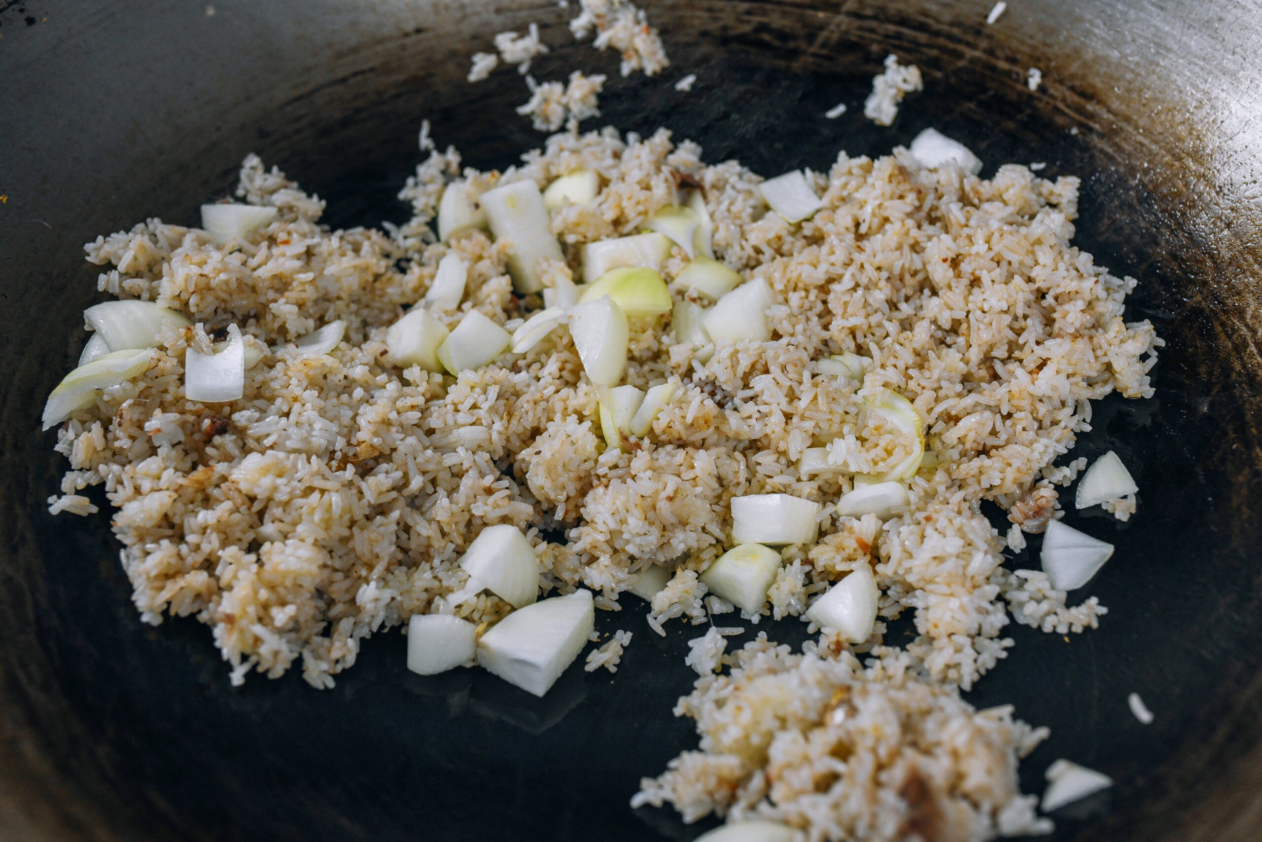 onion added to anchovies and rice