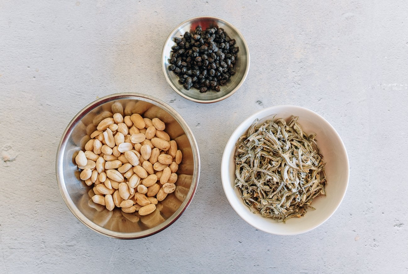 peanuts, anchovies, and black beans in dishes