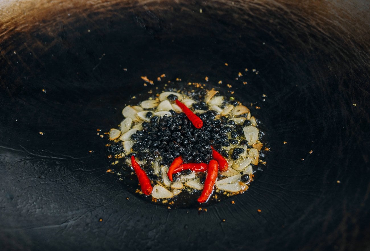 black beans and chilies with garlic and ginger in wok