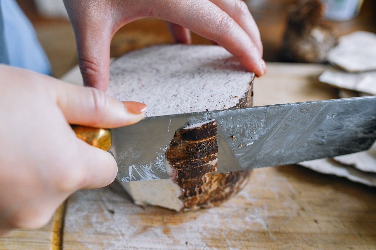 slicing skin off of taro