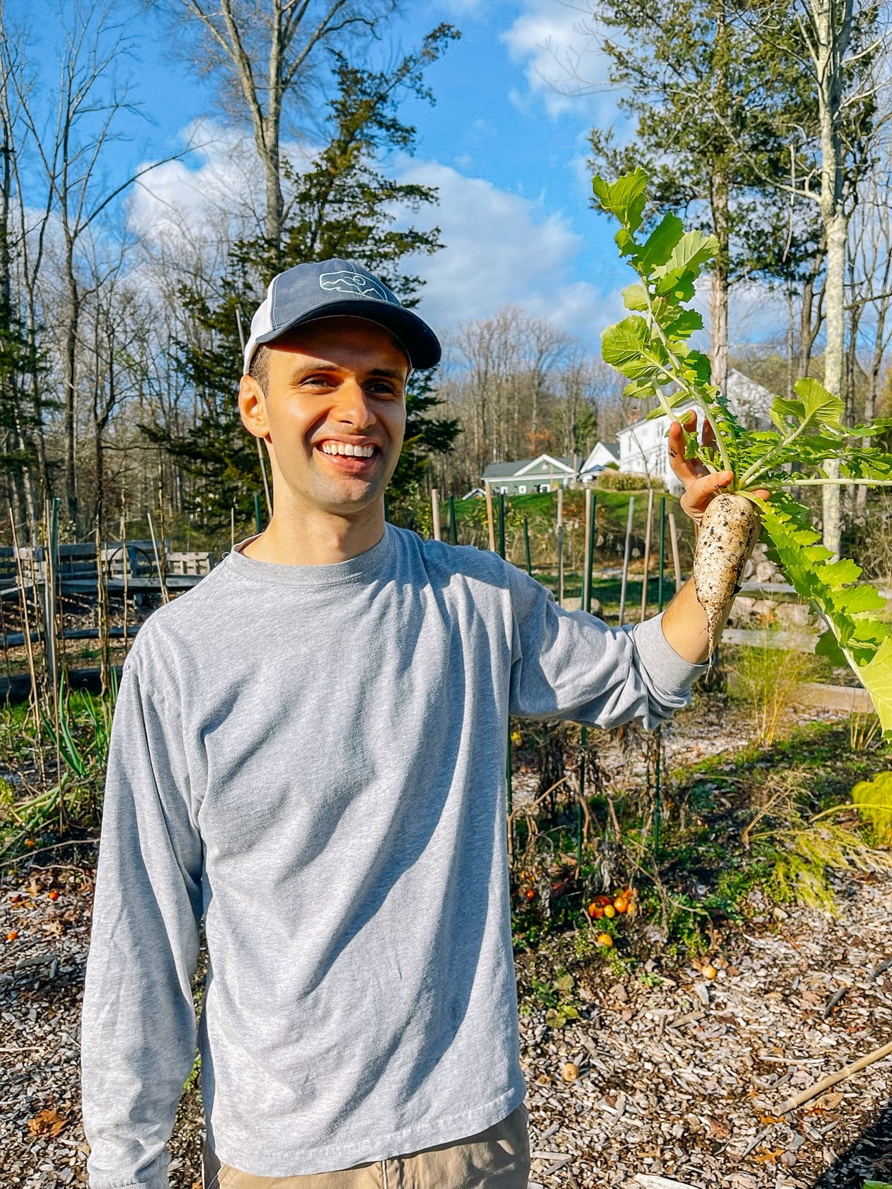 justin holding up daikon radish