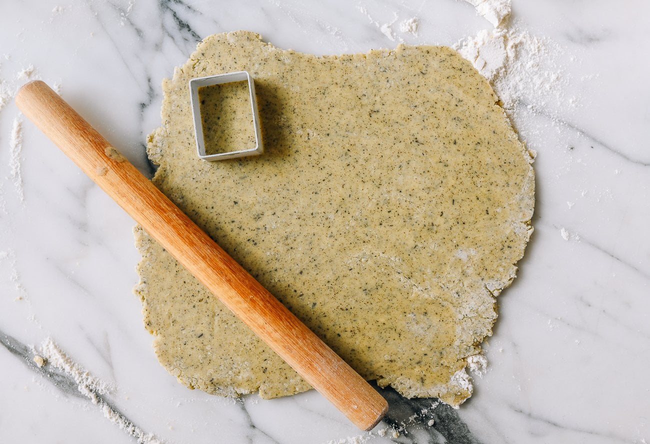 jasmine shortbread cookie dough rolled out with cookie cutter