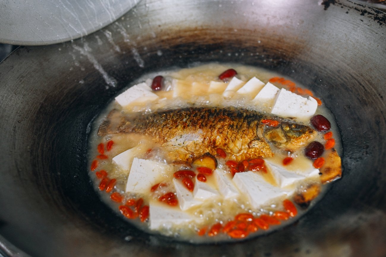 fish soup with tofu in wok