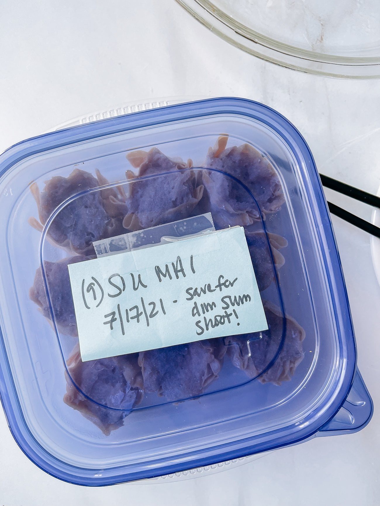 Tupperware of frozen siu mai