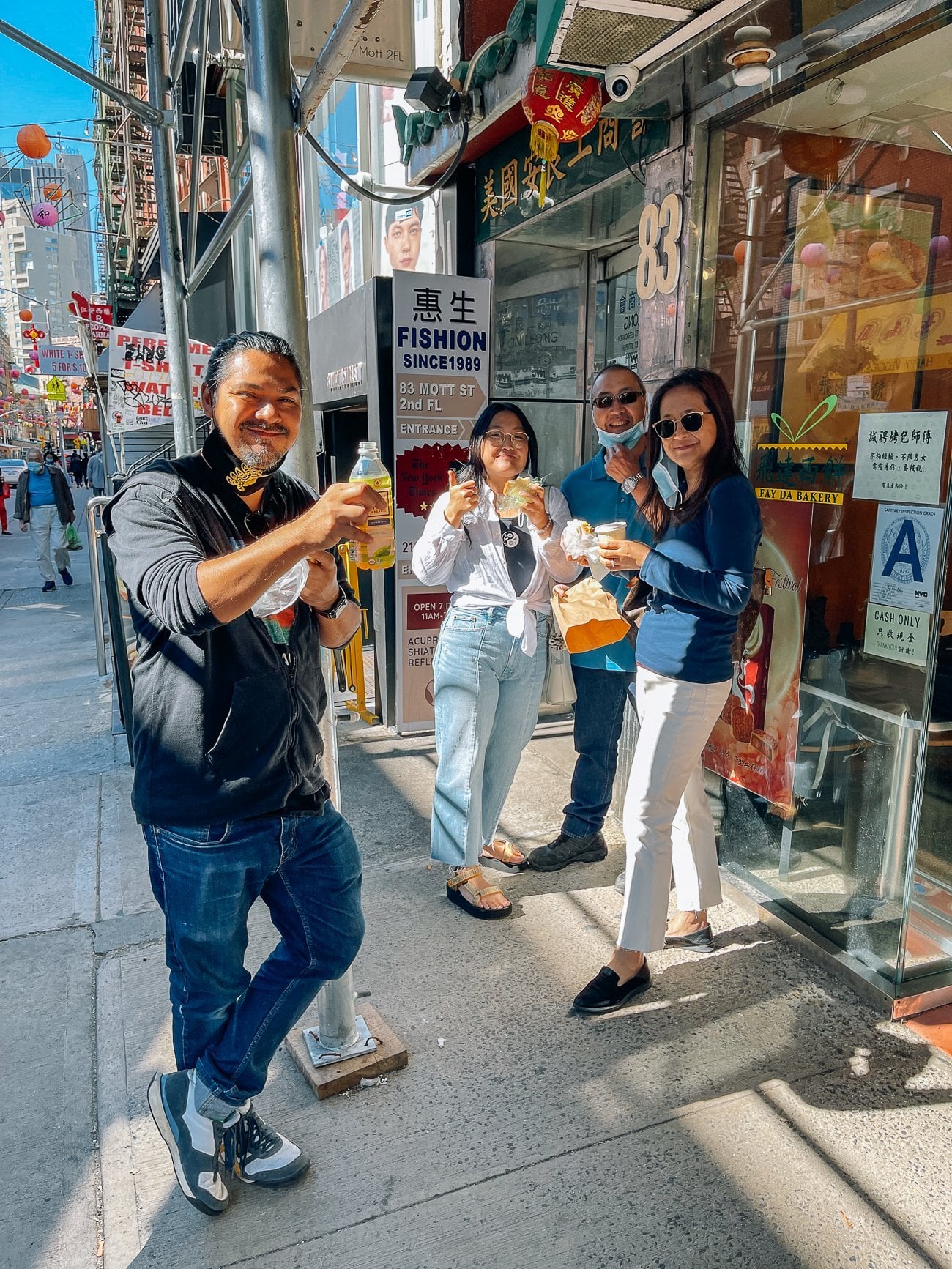 Alex, Kaitlin, Bill, and Judy in front of Chinatown bakery eating breakfast