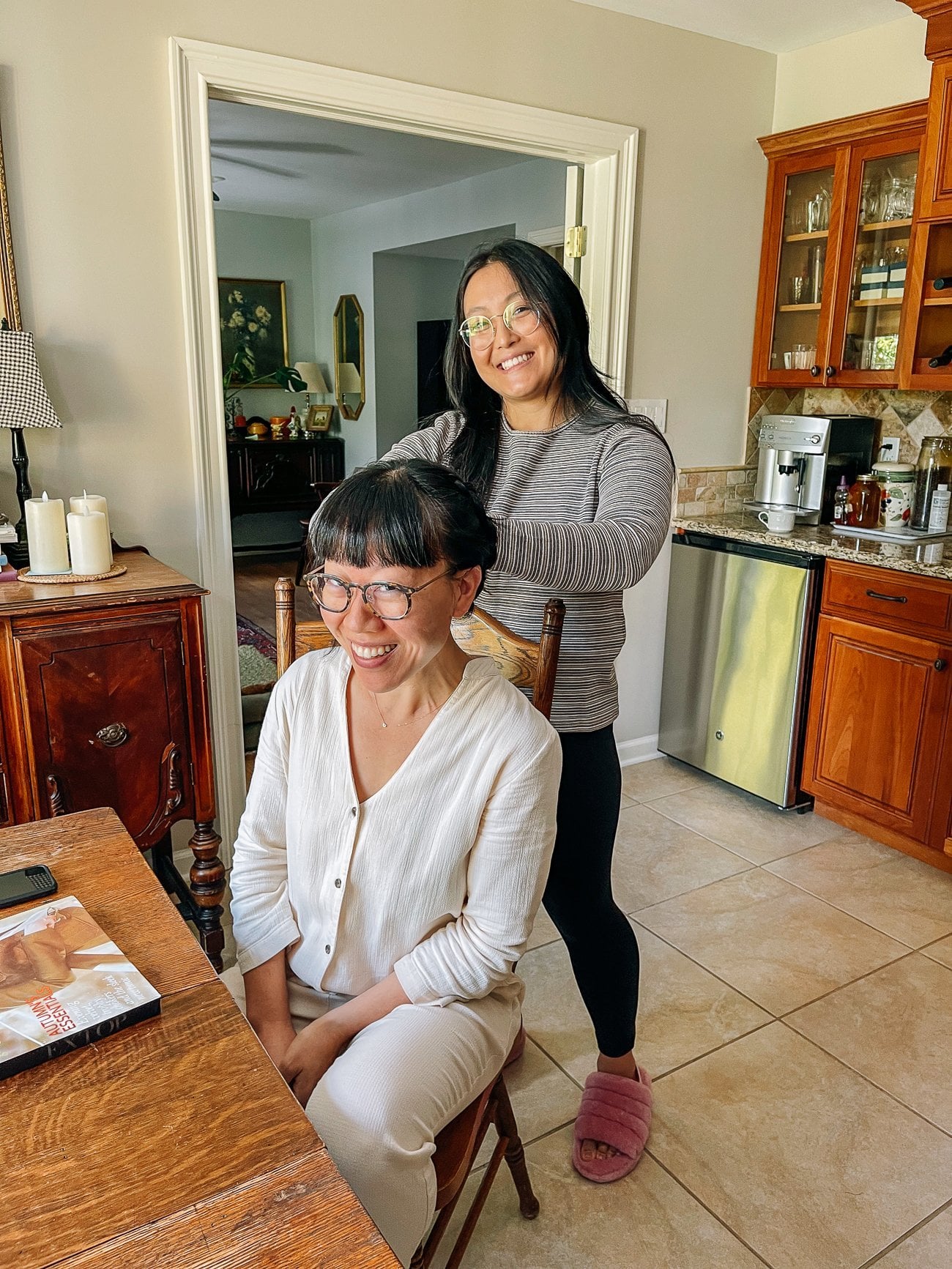 Kaitlin braiding Christine's hair