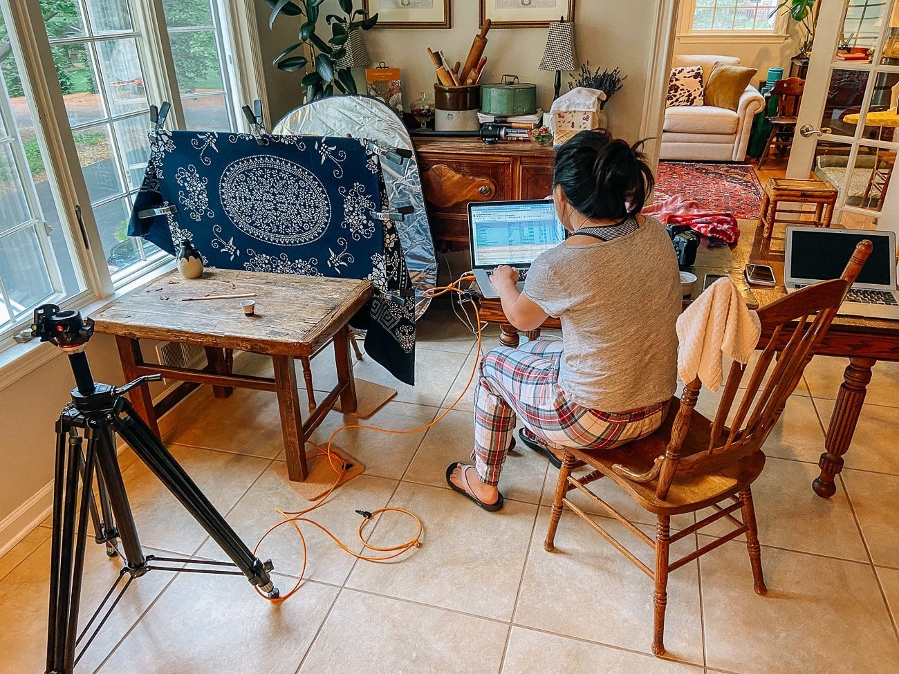 Sarah looking at photos during cookbook shoot - cookbook behind the scenes