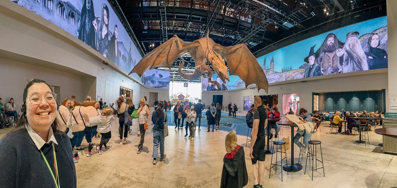 Kim posing with the Gringott's Dragon in the lobby of the Harry Potter studio tour