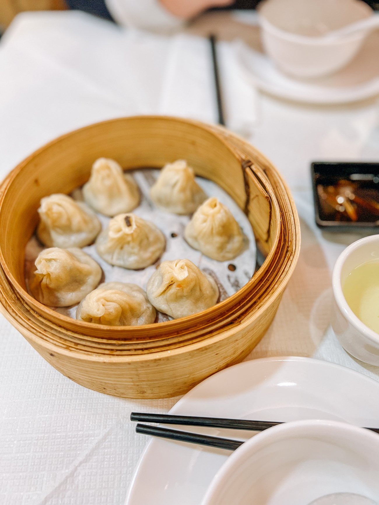 Steamed Xiao Long Bao in a bamboo steamer