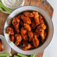 air fryer buffalo wings with blue cheese dressing and celery sticks
