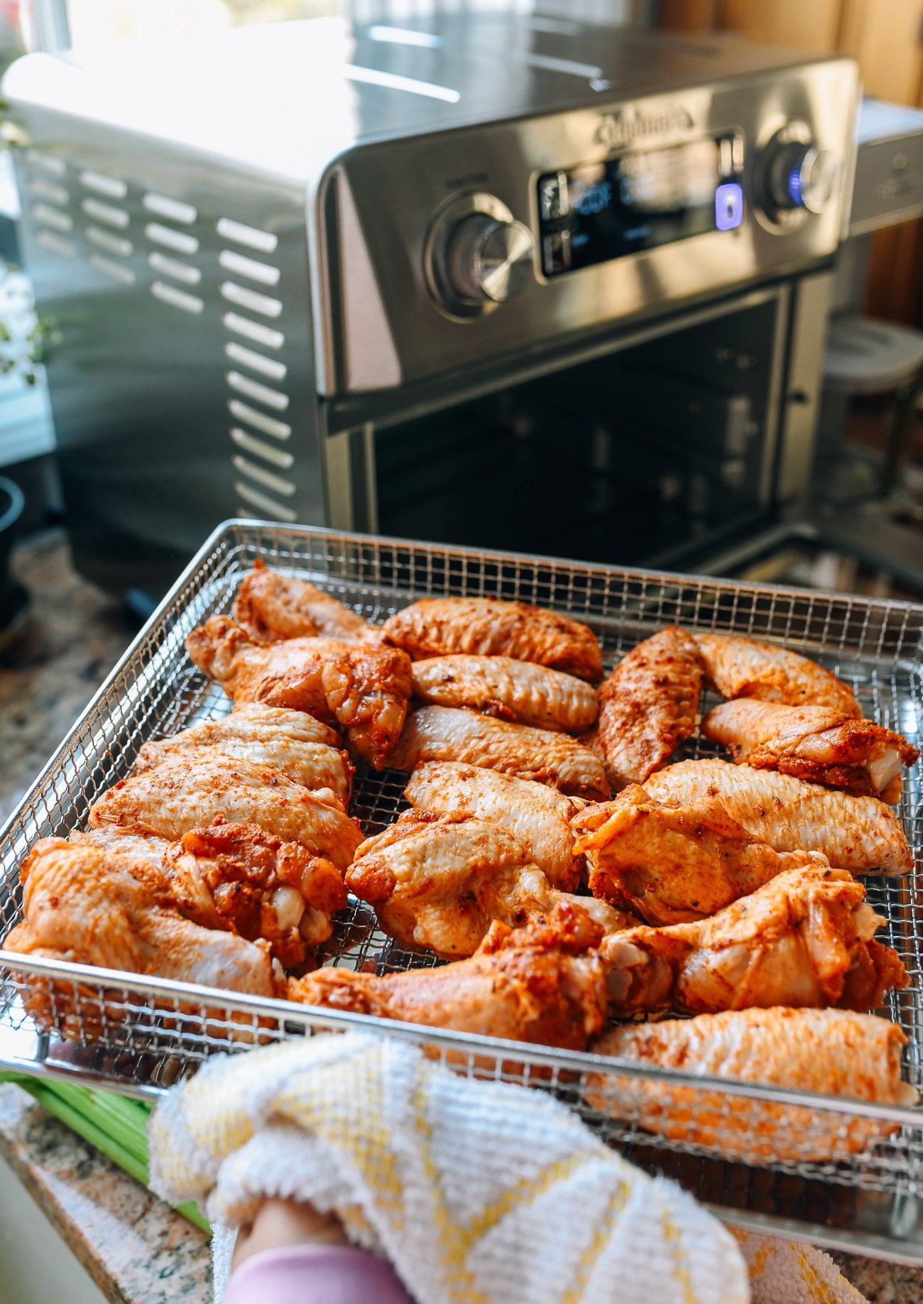 marinated chicken wings ready to go into Cuisinart air fryer toaster oven