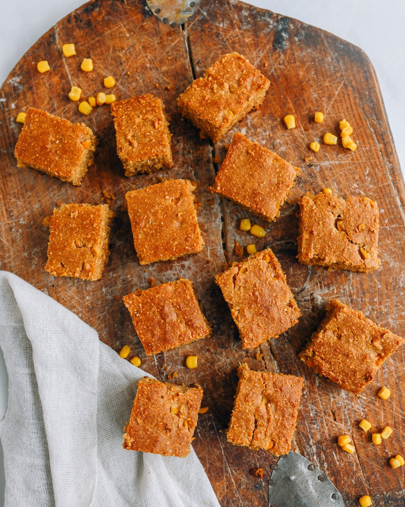 Squares of cornbread on cutting board