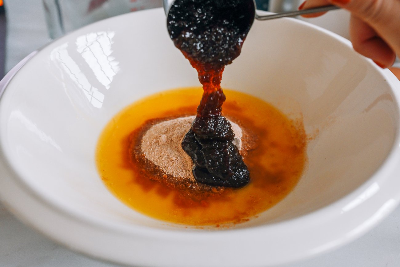 melted butter, date sugar, and date syrup in bowl