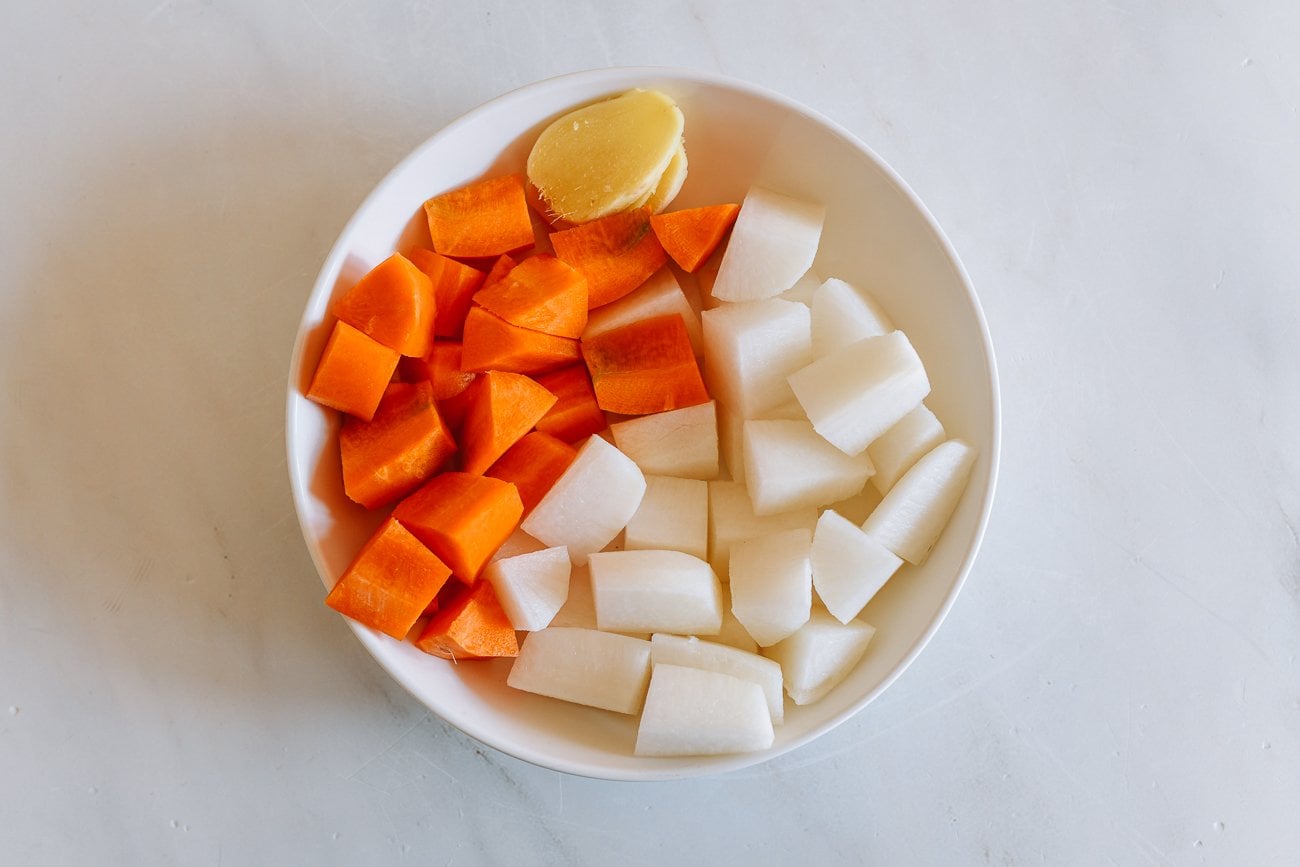plate with carrot, ginger, and daikon