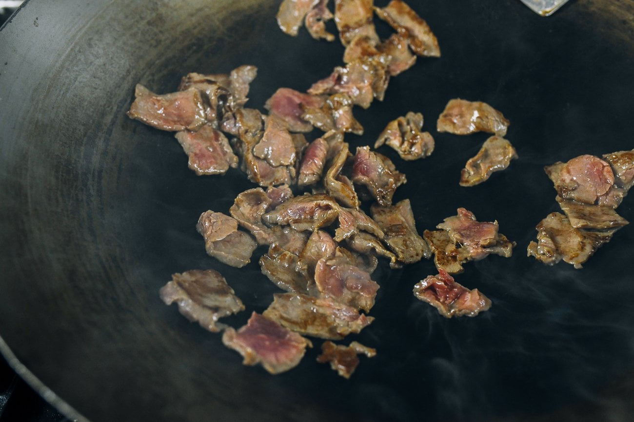 seared flank steak in wok