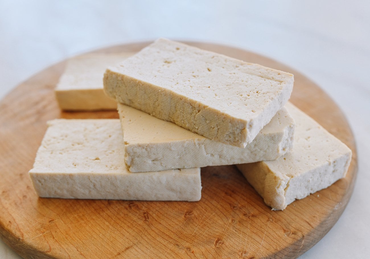 pressed firm tofu on cutting board