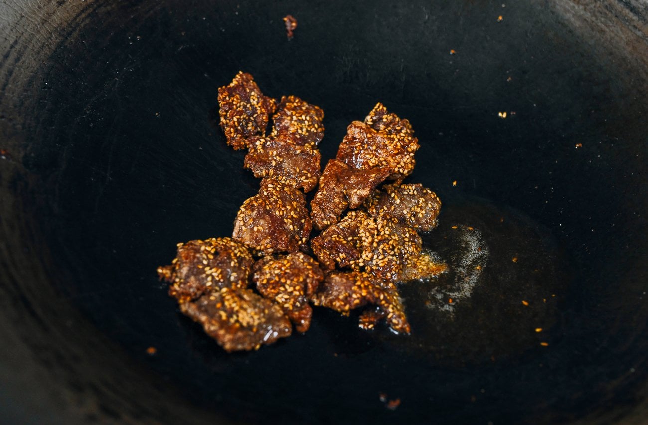 crispy sesame beef in wok