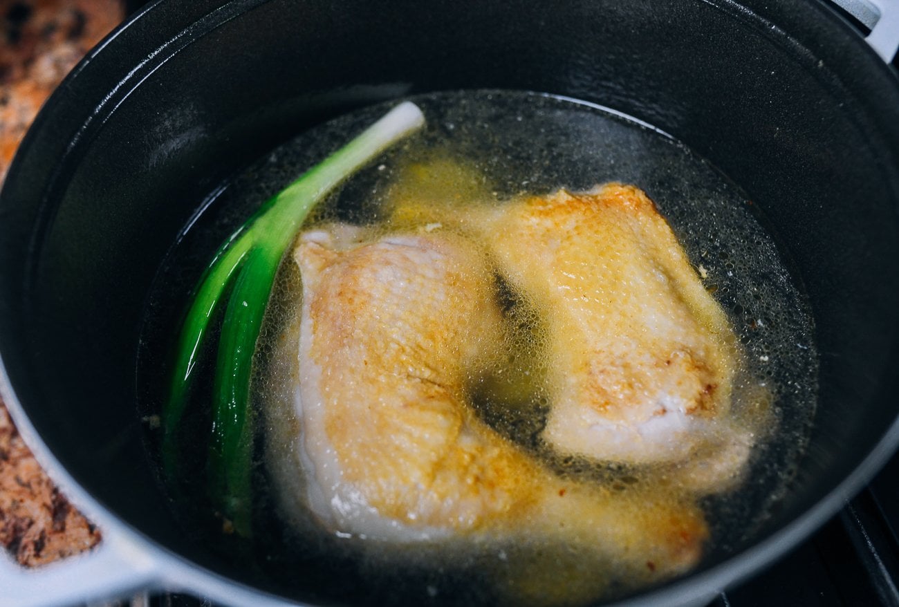 Chinese chicken noodle soup ingredients in pot
