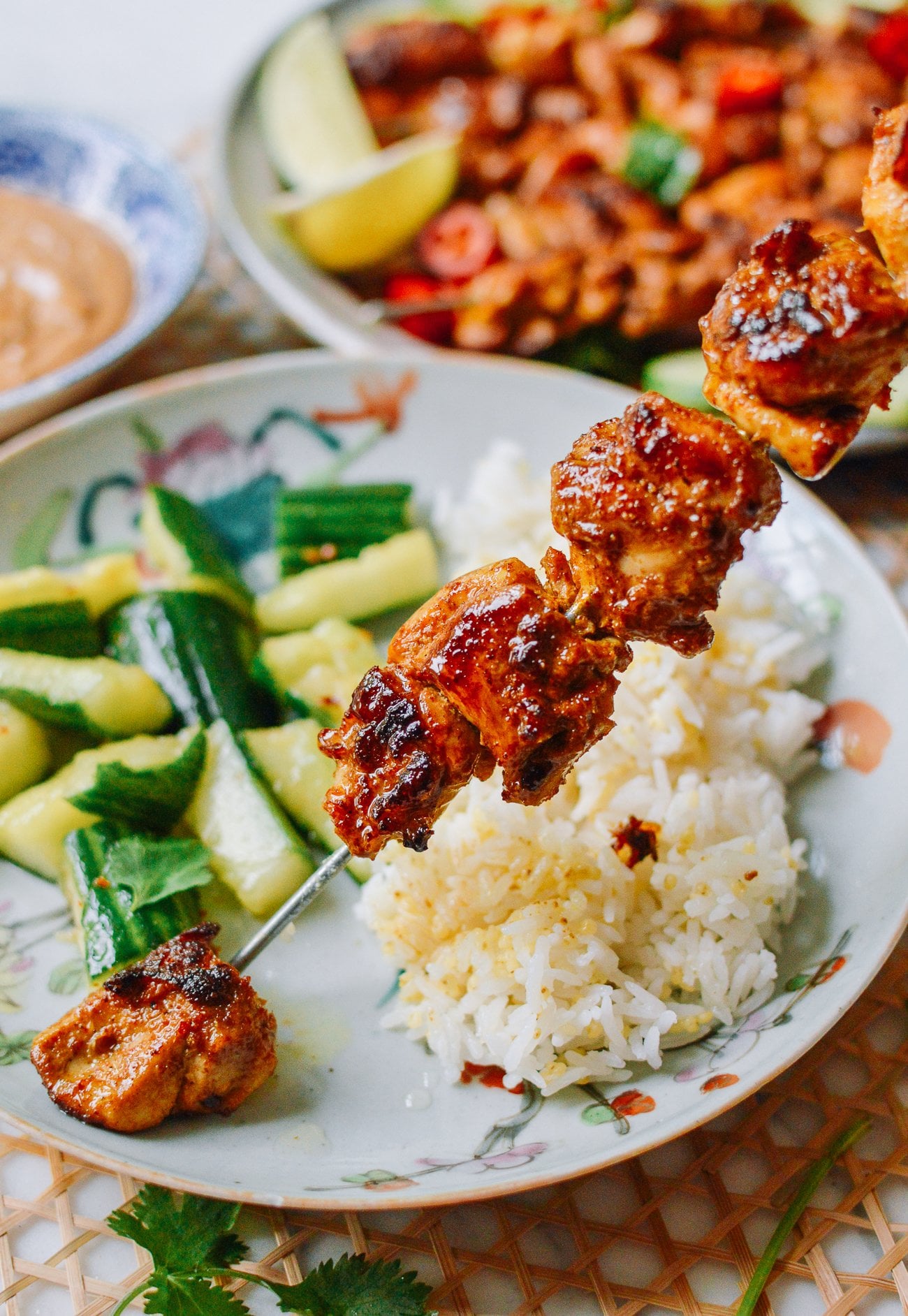 pulling chicken off skewer