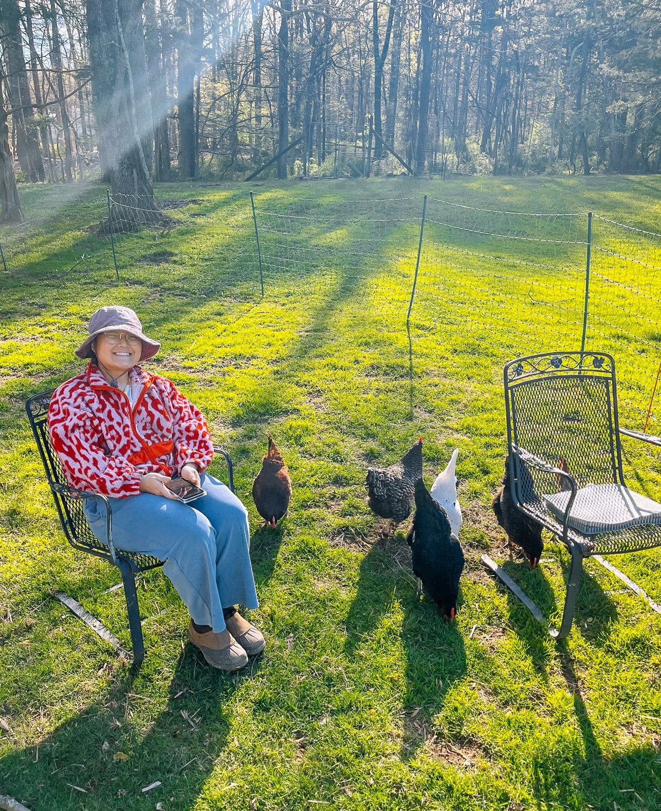 kaitlin sitting with chickens