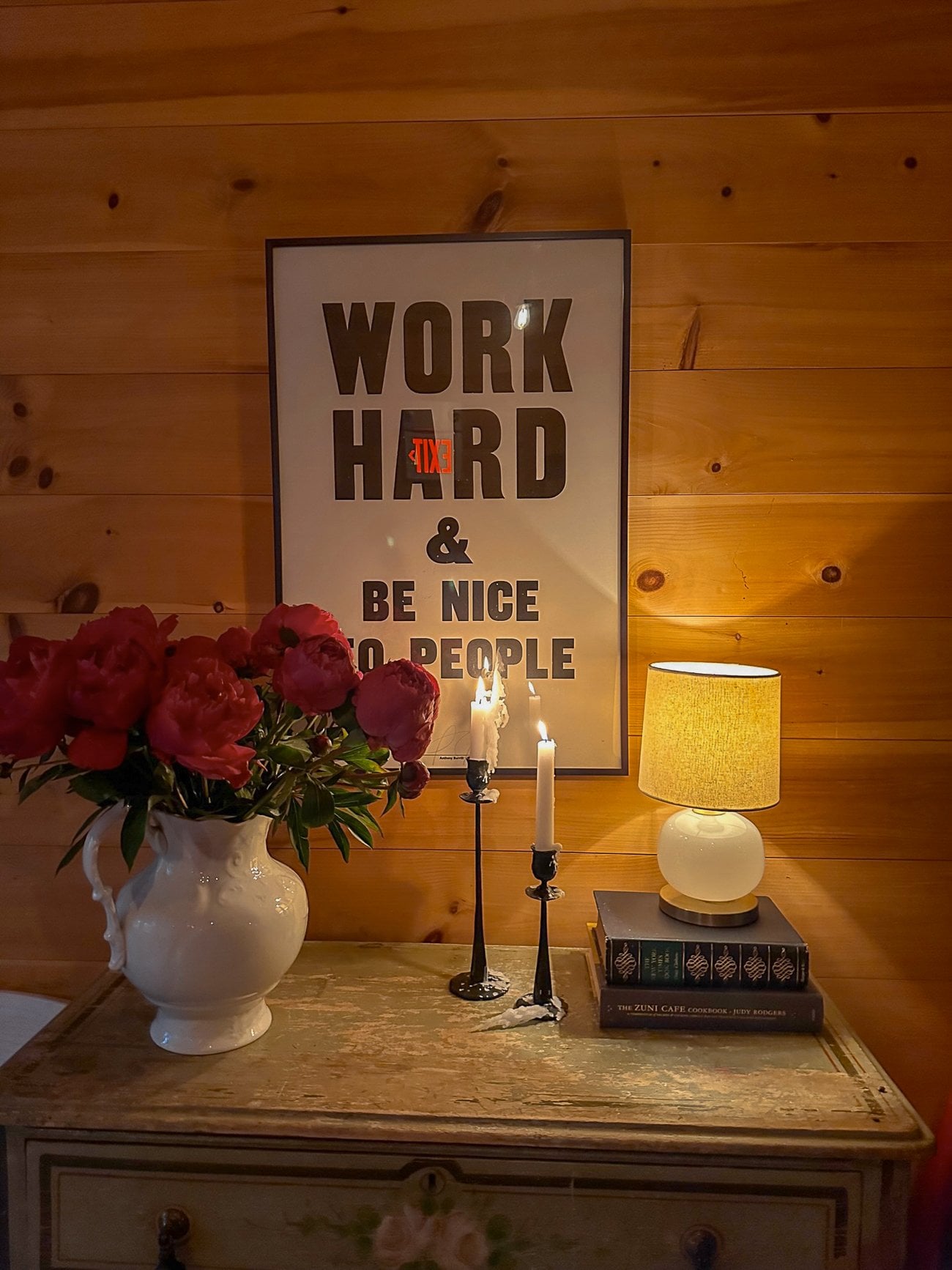 A sign that says WORK HARD & BE NICE TO PEOPLE at The Lost Kitchen