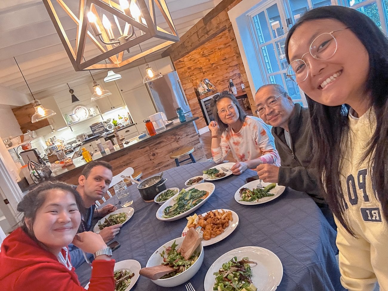 Selfie at the dinner table eating salad and fried seafood leftovers