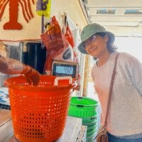 Judy watching lobsters being weighed